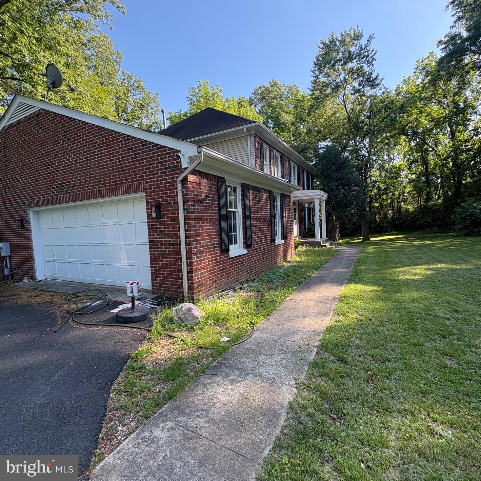 3502 Holly Road Annandale, VA 22003 - Photo 13 of 57 a front view of a house with a yard