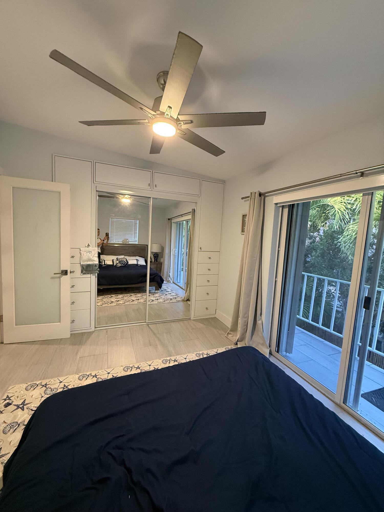 116 Long Ben Drive Key Largo, FL 33037 - Photo 11 of 26 a view of a livingroom with furniture wooden floor and window