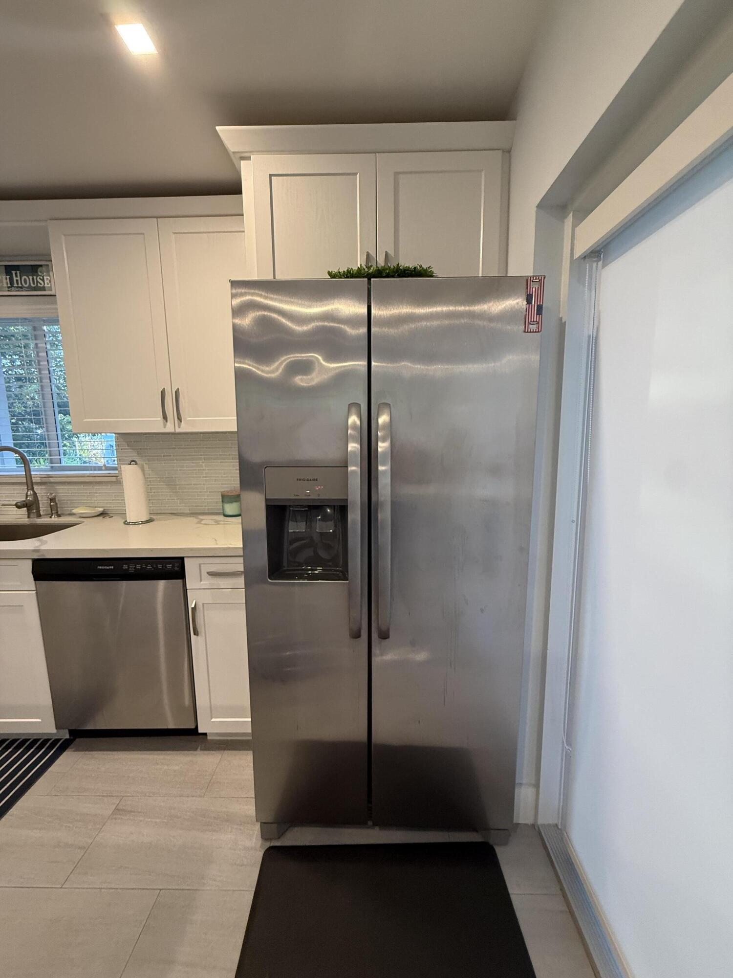 116 Long Ben Drive Key Largo, FL 33037 - Photo 7 of 26 a kitchen with a refrigerator and a sink