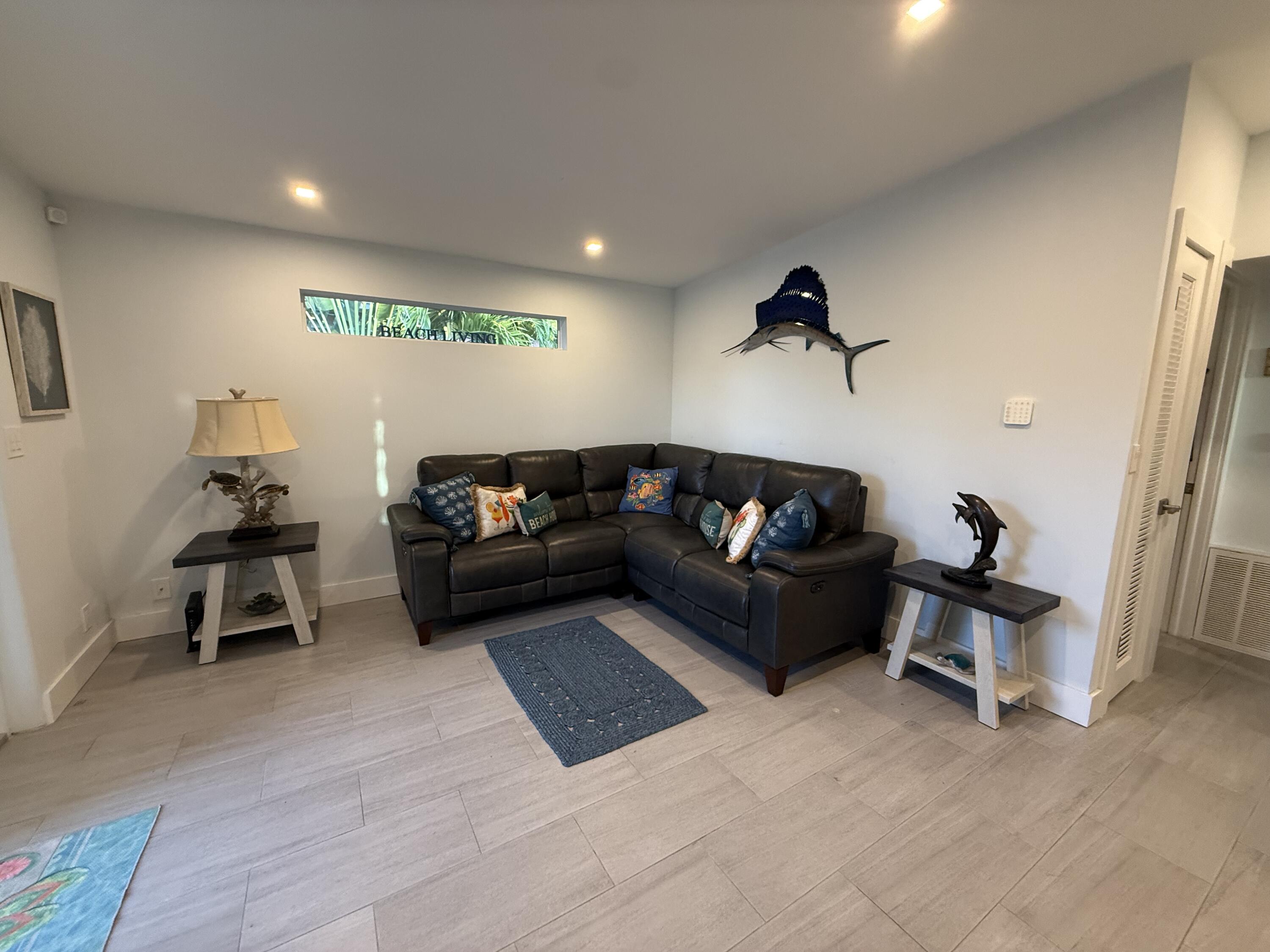116 Long Ben Drive Key Largo, FL 33037 - Photo 8 of 26 a living room with furniture and a wooden floor