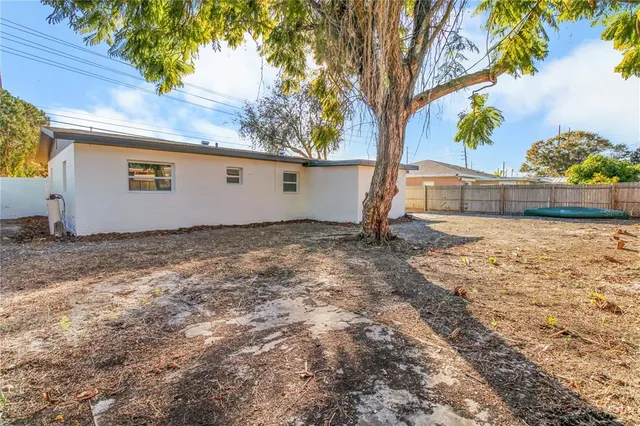 a backyard of a house with lots of green space