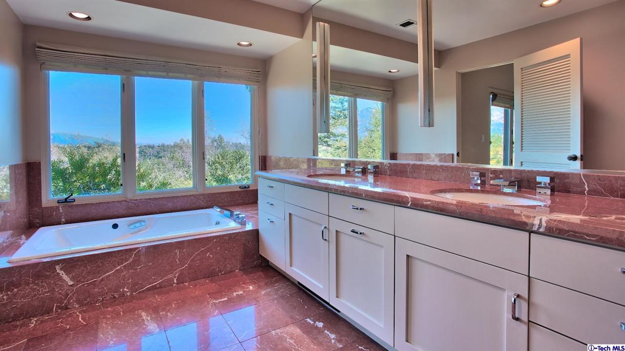 1114 Heatherside Road Pasadena, CA 91105 - Photo 20 of 35 a spacious bathroom with a large tub sink and mirror