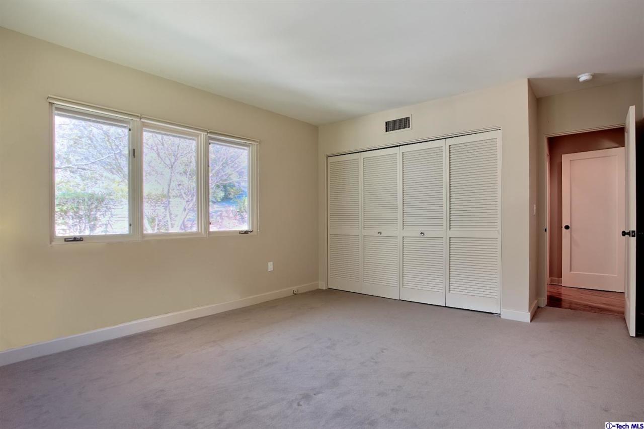1114 Heatherside Road Pasadena, CA 91105 - Photo 22 of 35 an empty room with windows