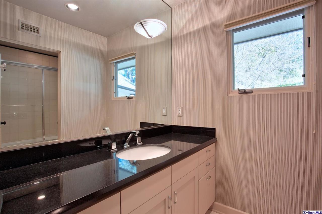 1114 Heatherside Road Pasadena, CA 91105 - Photo 24 of 35 a bathroom with a sink and a mirror