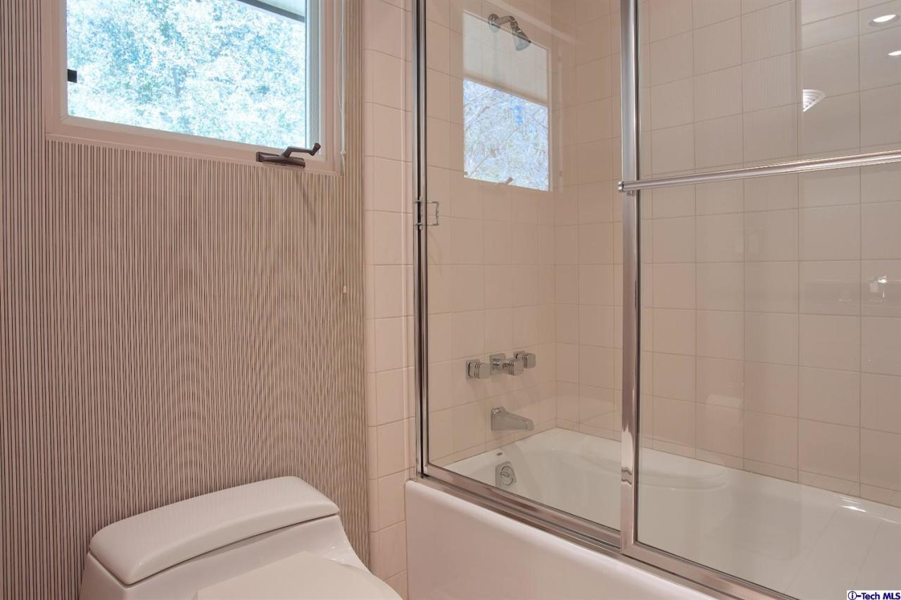 1114 Heatherside Road Pasadena, CA 91105 - Photo 26 of 35 a bathroom with a shower and toilet