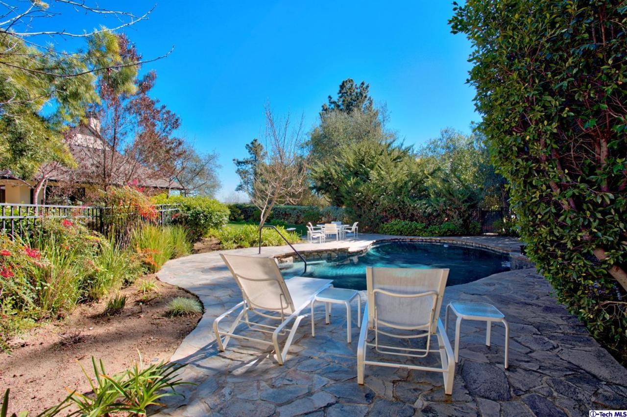 1114 Heatherside Road Pasadena, CA 91105 - Photo 31 of 35 a view of backyard with seating space and trees