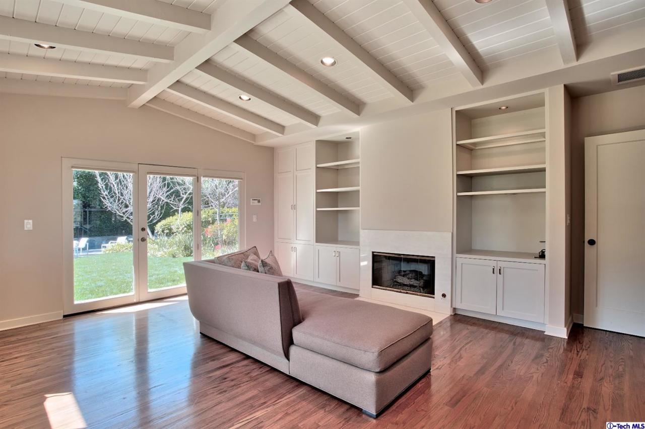1114 Heatherside Road Pasadena, CA 91105 - Photo 7 of 35 a living room with furniture and a fireplace
