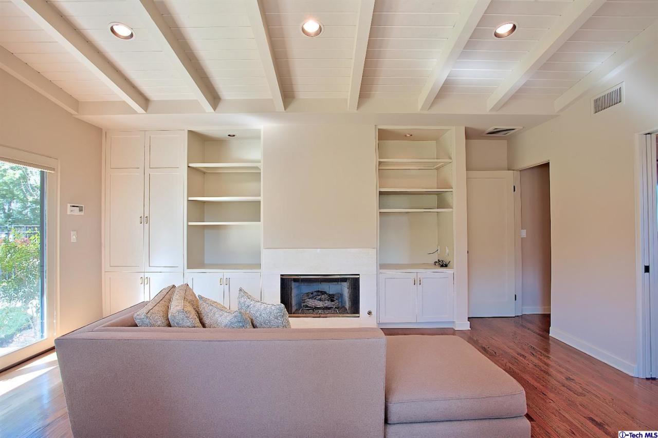 1114 Heatherside Road Pasadena, CA 91105 - Photo 9 of 35 a living room with furniture and a fireplace