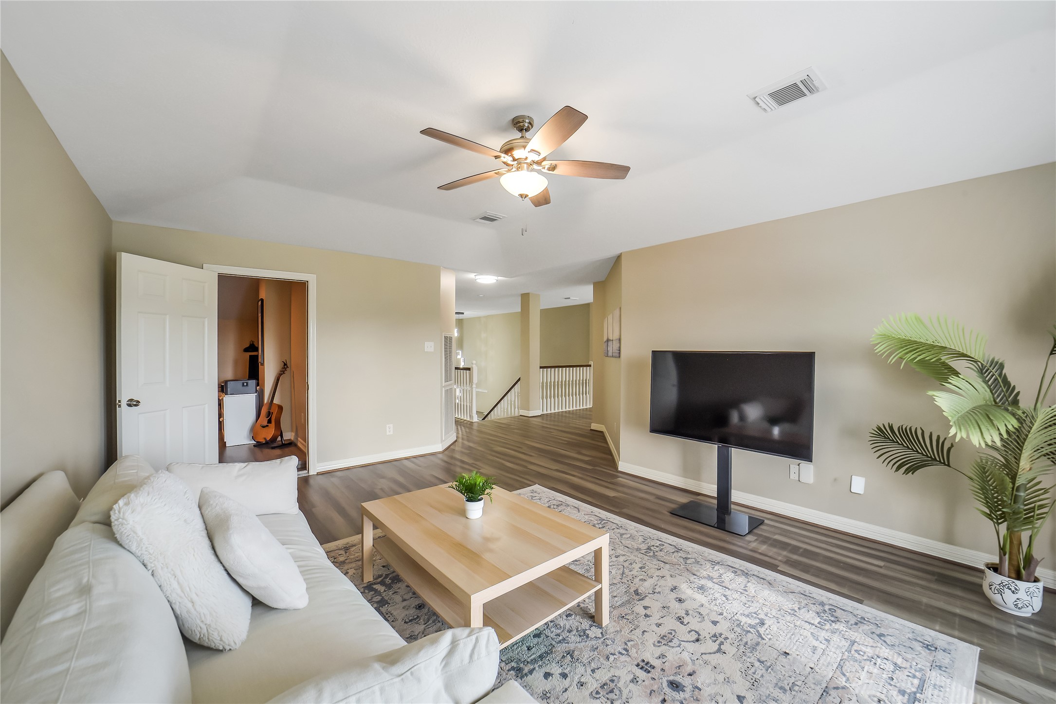 24403 Falcon Point Drive Katy, TX 77494 - Photo 17 of 32 Expansive game room located on the second floor offers a versatile space for relaxation and family movie nights.