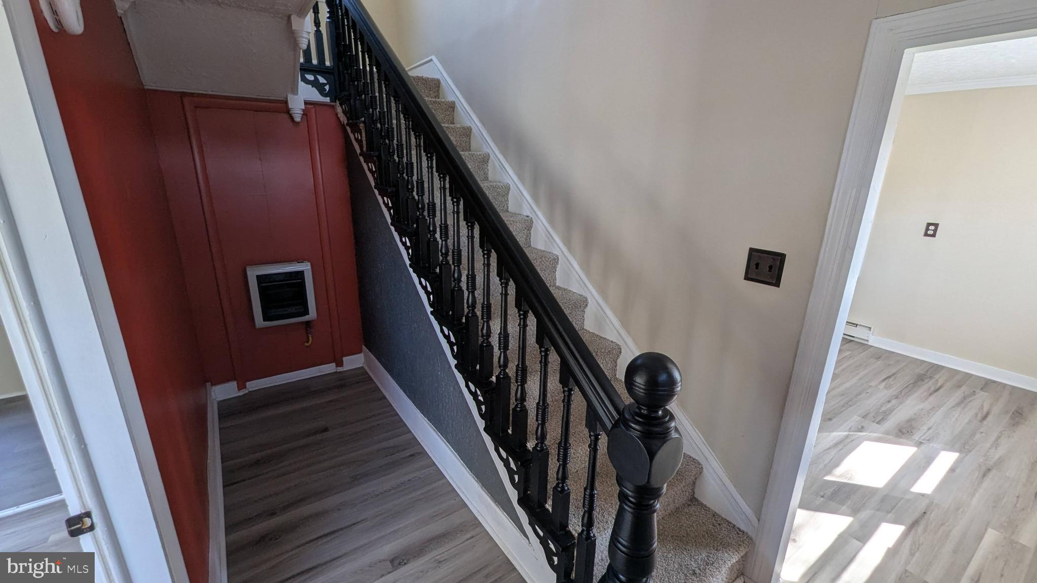 23232 Lola Wheatley Road Deal Island, MD 21821 - Photo 11 of 51 a view of staircase with wooden floor and white walls