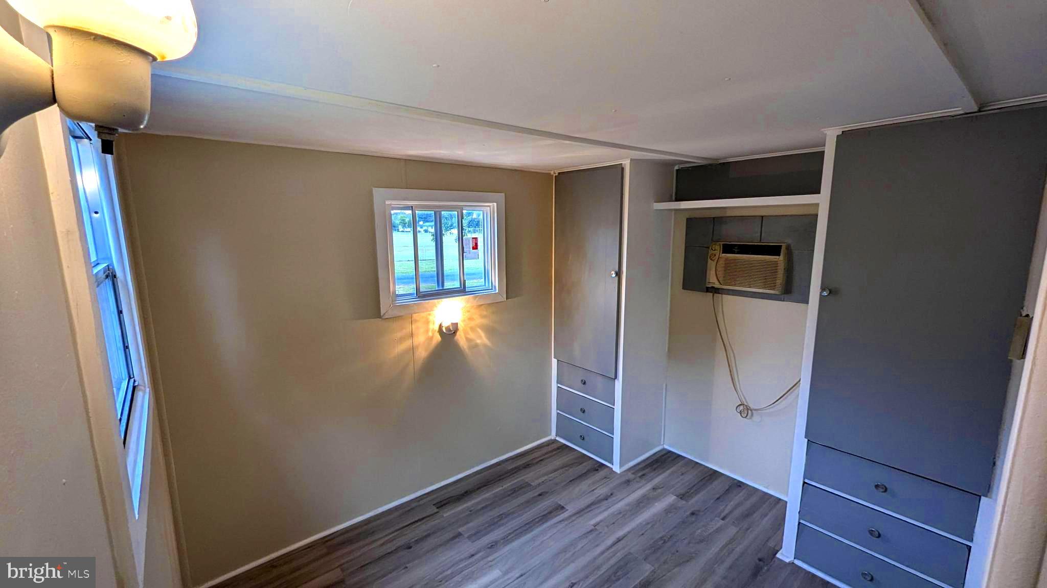 23232 Lola Wheatley Road Deal Island, MD 21821 - Photo 15 of 51 a view of empty room with wooden floor and fan