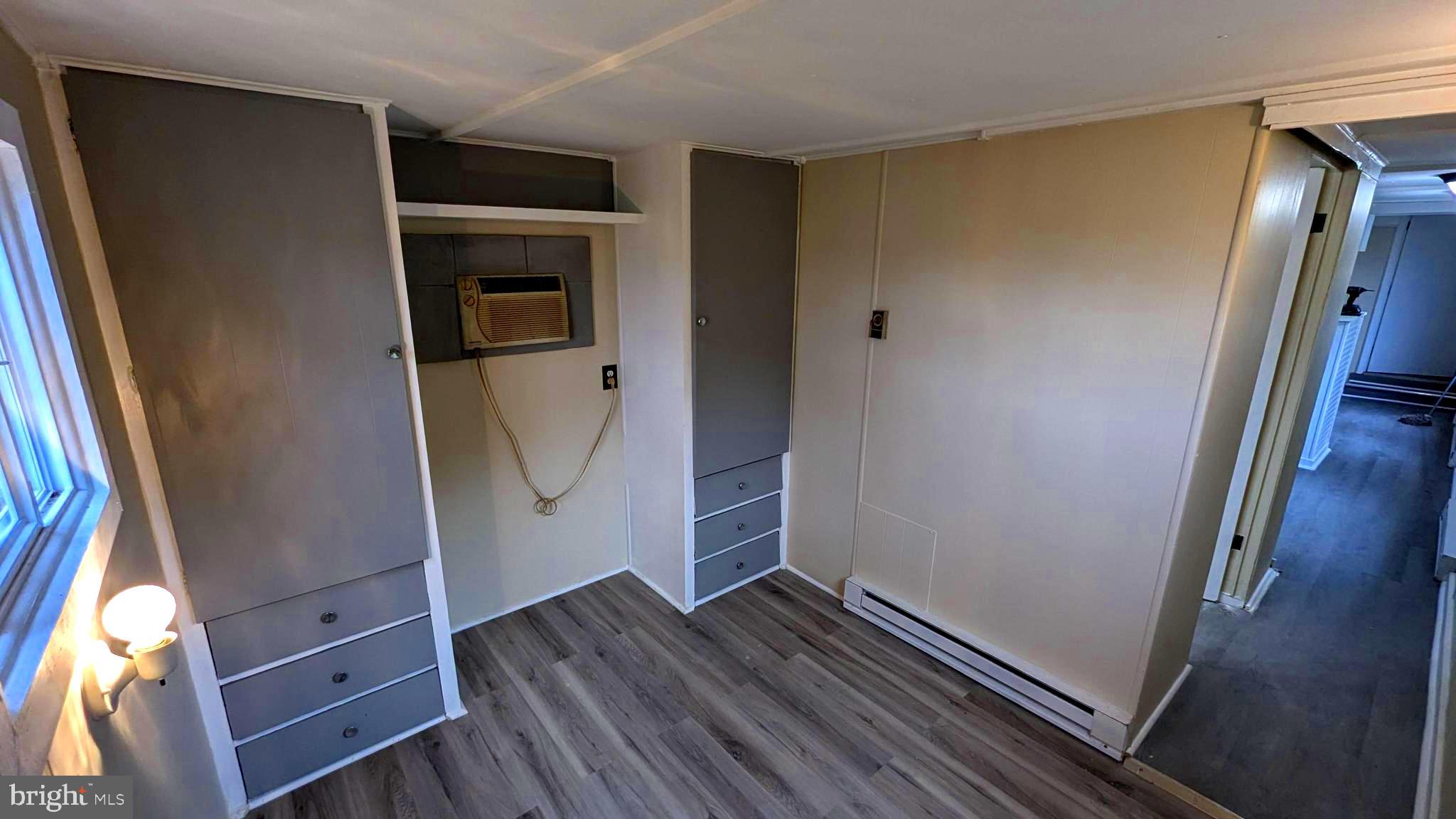 23232 Lola Wheatley Road Deal Island, MD 21821 - Photo 16 of 51 a view of walk in closet with wooden floor