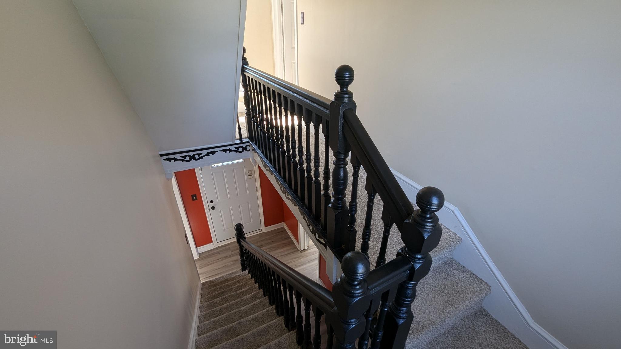 23232 Lola Wheatley Road Deal Island, MD 21821 - Photo 40 of 51 a view of staircase with railing and white walls