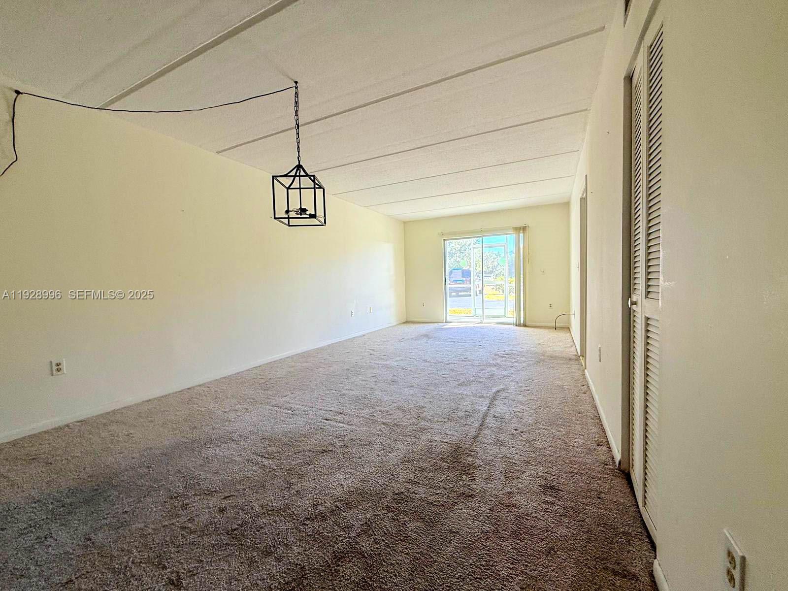 649 South Tamiami Trail, Unit 112 Venice, FL 34285 - Photo 11 of 25 a view of a hallway with windows