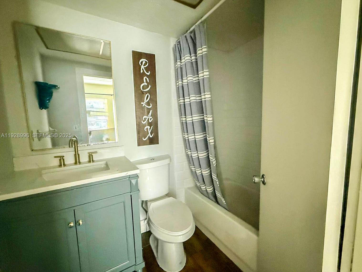 649 South Tamiami Trail, Unit 112 Venice, FL 34285 - Photo 18 of 25 a bathroom with a sink a toilet and shower