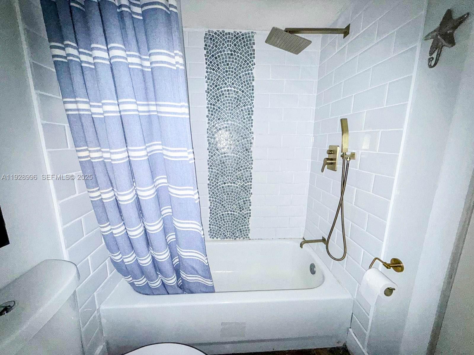 649 South Tamiami Trail, Unit 112 Venice, FL 34285 - Photo 19 of 25 a bathroom with a bathtub and shower