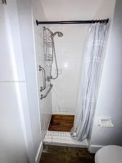 a view of a glass door with a yard