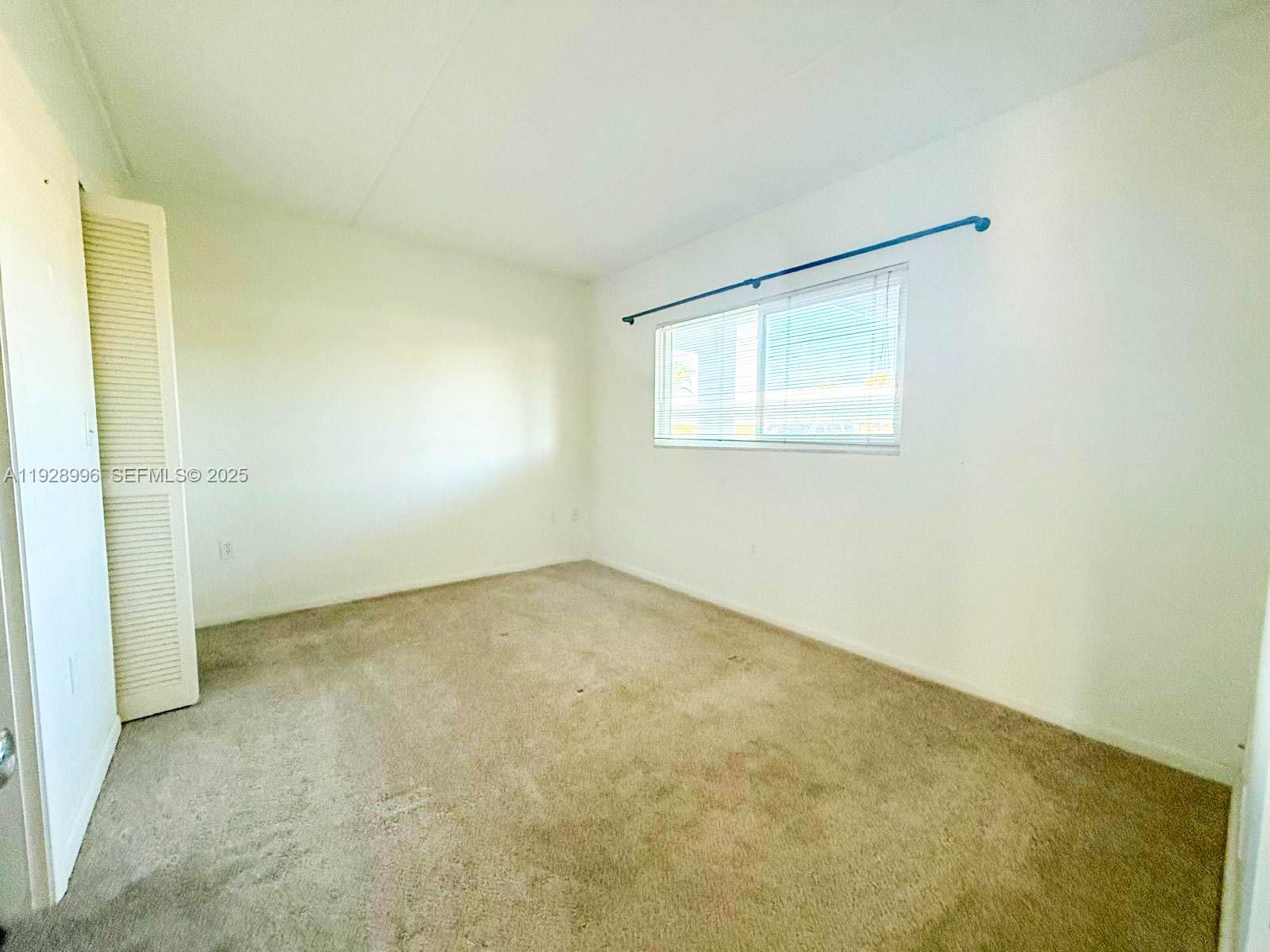 649 South Tamiami Trail, Unit 112 Venice, FL 34285 - Photo 25 of 25 an empty room with a window