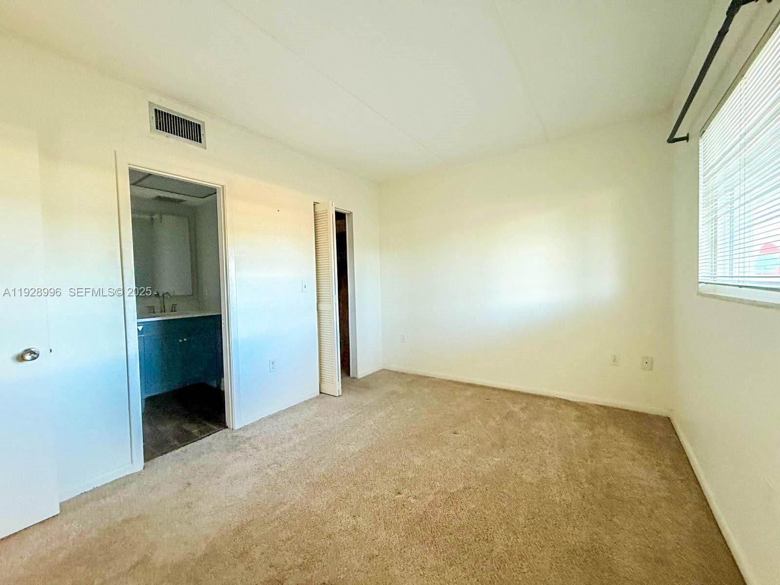 649 South Tamiami Trail, Unit 112 Venice, FL 34285 - Photo 8 of 25 an empty room with windows