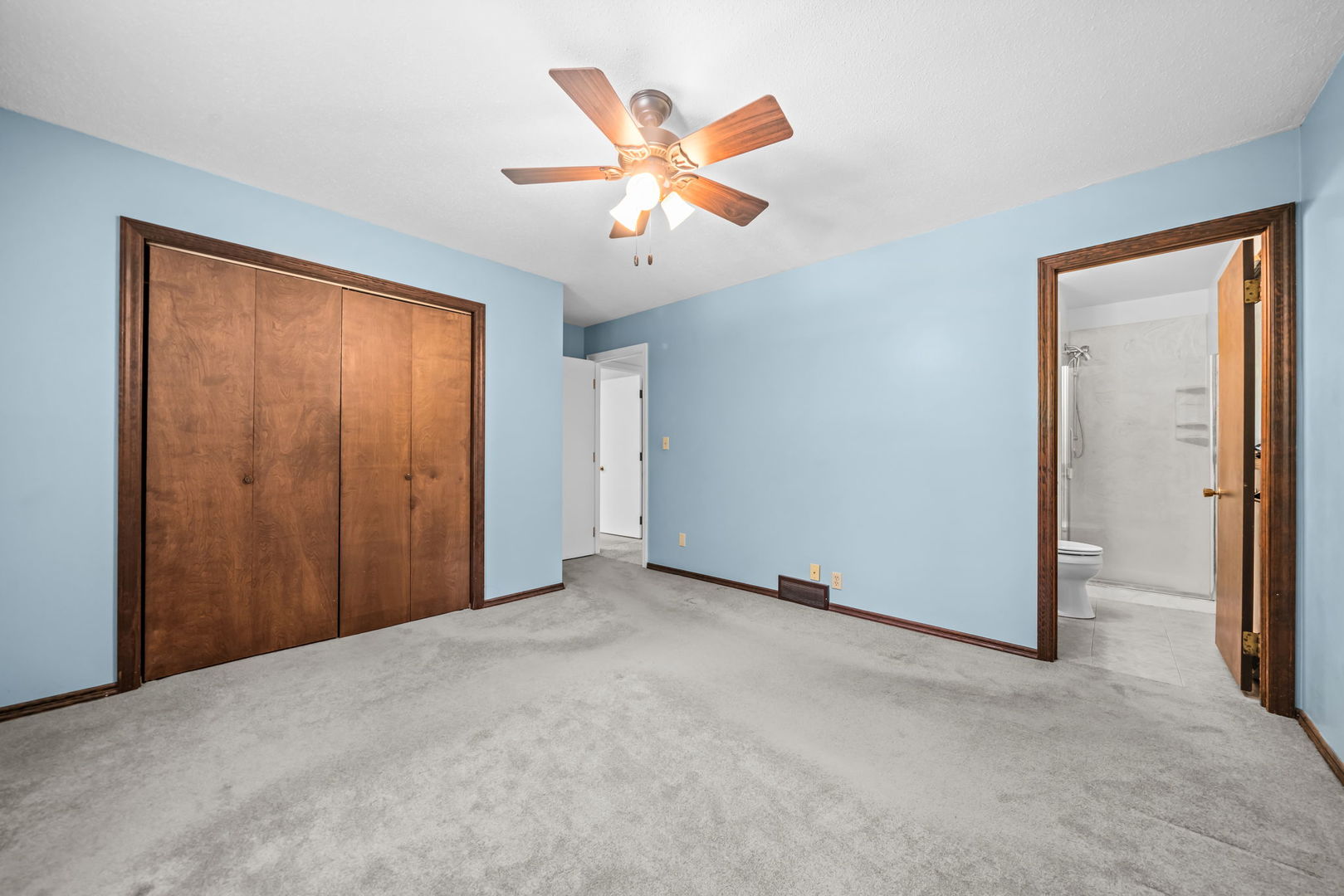 5748 South Skare Road Rochelle, IL 61068 - Photo 16 of 45 an empty room with closet and ceiling fan