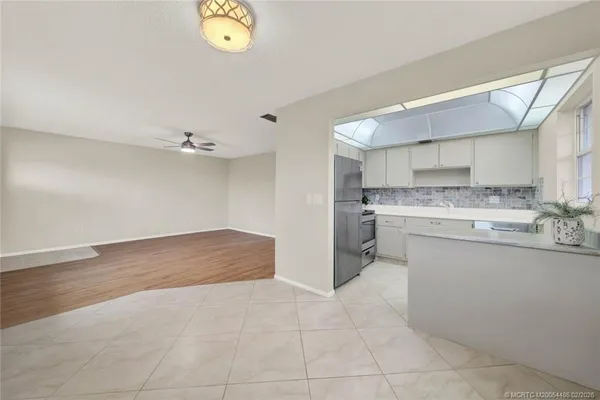 a kitchen with a cabinets and chandelier