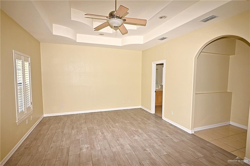 3509 Knight Avenue Edinburg, TX 78539 - Photo 12 of 18 wooden floor in an empty room with a window