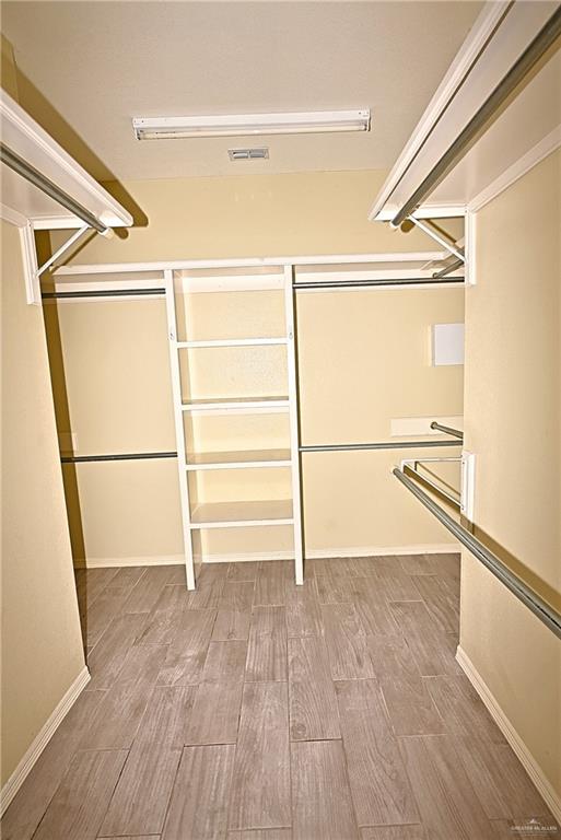 3509 Knight Avenue Edinburg, TX 78539 - Photo 15 of 18 a view of an empty room with wooden floor and a window