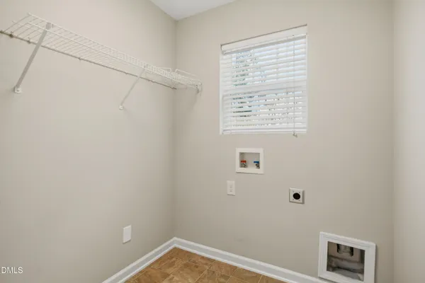 a view of a small space with racks on the wall