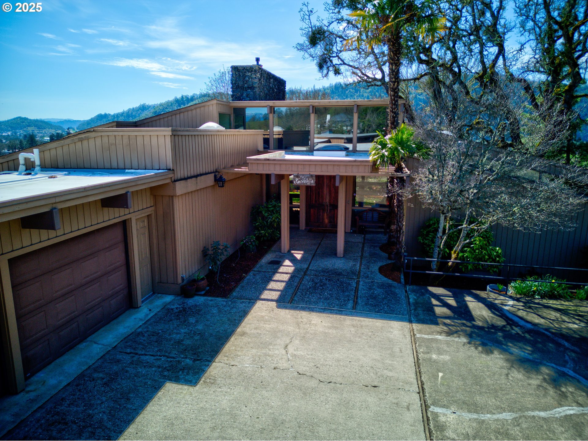 141 Umpqua College Road Roseburg, OR 97470 - Photo 32 of 45 a view of a patio with chairs and potted plants