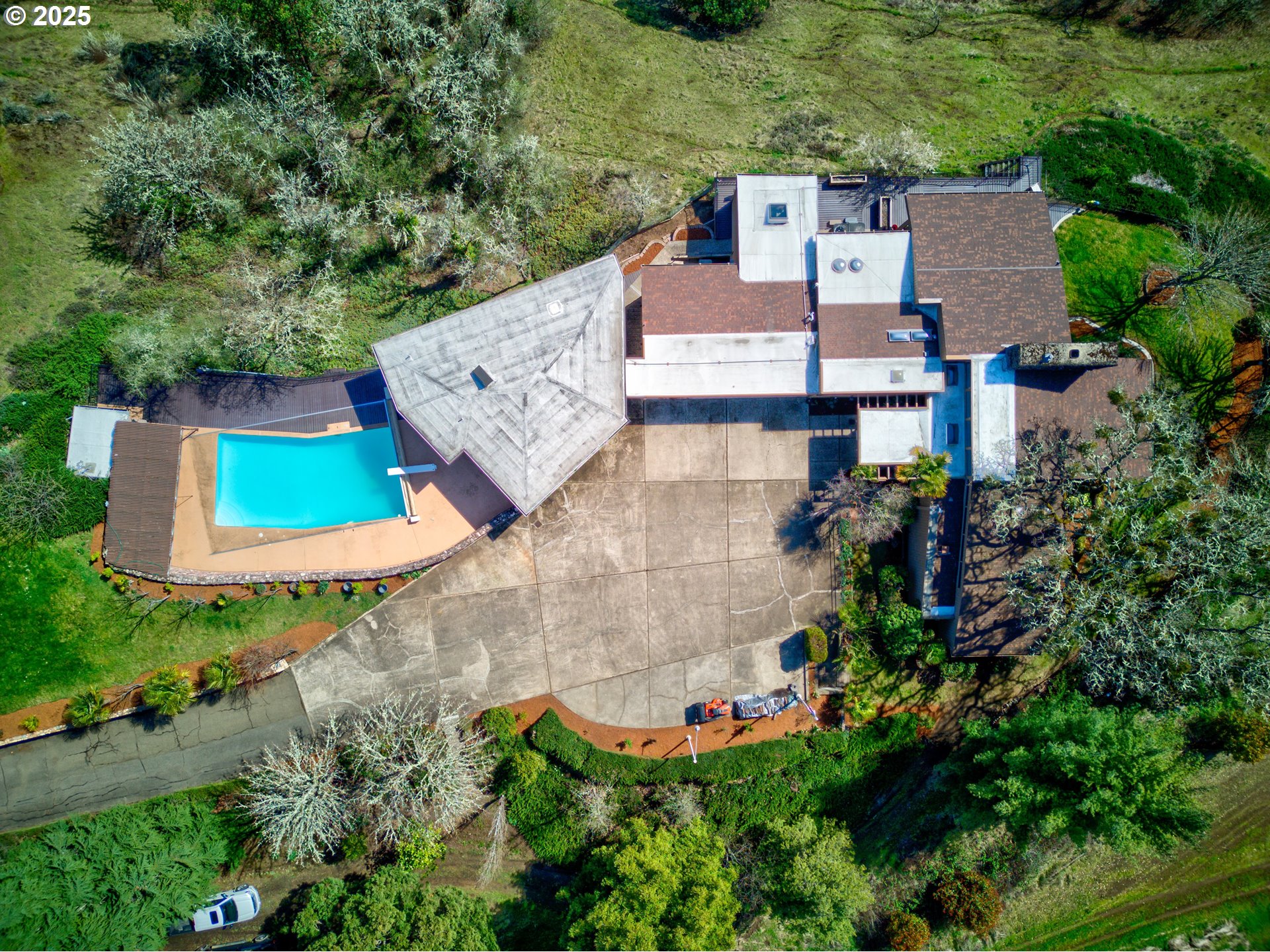141 Umpqua College Road Roseburg, OR 97470 - Photo 33 of 45 an aerial view of a house with swimming pool and garden