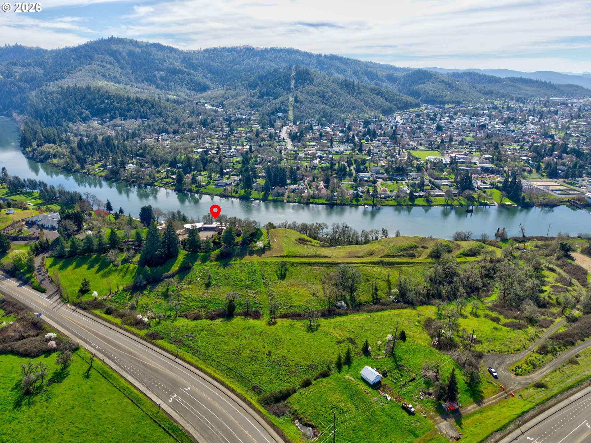 141 Umpqua College Road Roseburg, OR 97470 - Photo 39 of 45 a view of a lake with a mountain