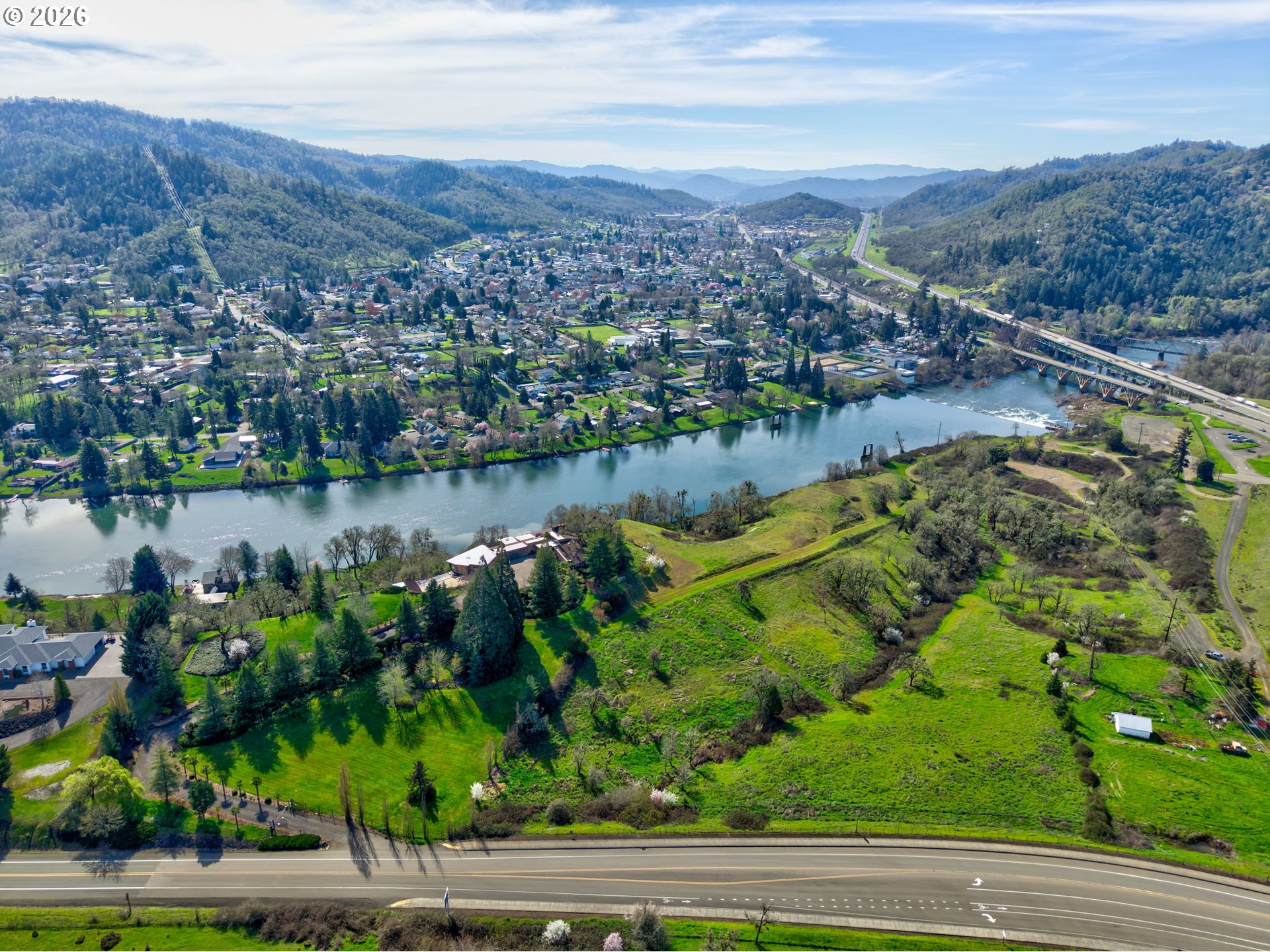 141 Umpqua College Road Roseburg, OR 97470 - Photo 40 of 45 an aerial view of a houses with a yard and lake view