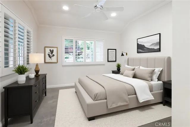 a bedroom with a bed and a potted plant