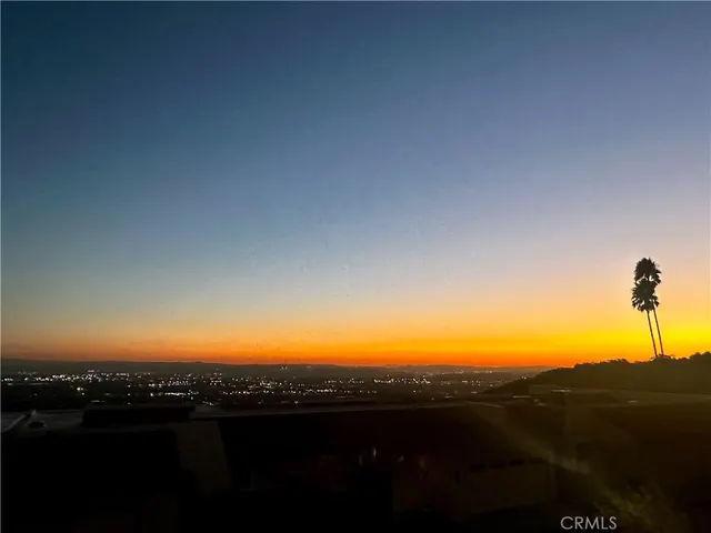 a view of a backyard with sitting area