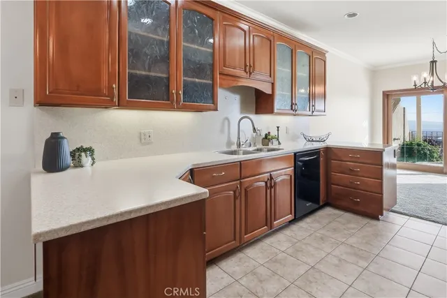 a kitchen with stainless steel appliances granite countertop a sink and cabinets