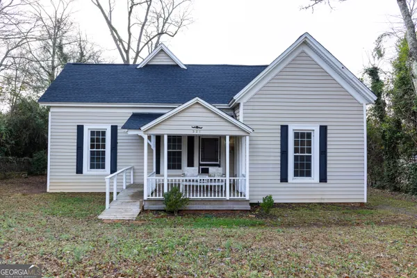 front view of a house with a yard