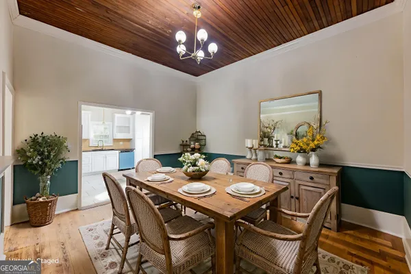 a view of a dining room with furniture window and flowerpot