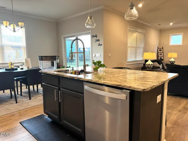 a view of kitchen with furniture and refrigerator