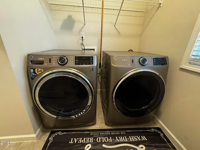 a front view of house with yard outdoor seating and green space