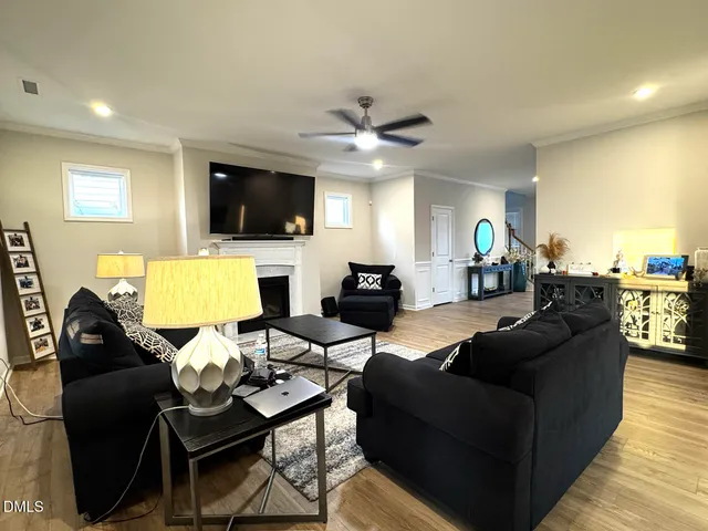 a living room with furniture fireplace and a flat screen tv