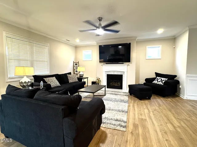 a view of a living room with a wooden floor