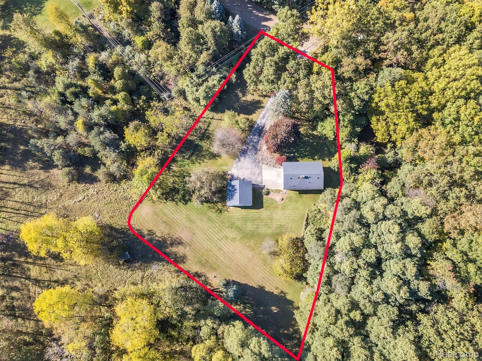 3200 Sexton Road Howell, MI 48843 - Photo 2 of 35 Aerial view with the 5 aces with the house and it also includes 2 additional acres to the left