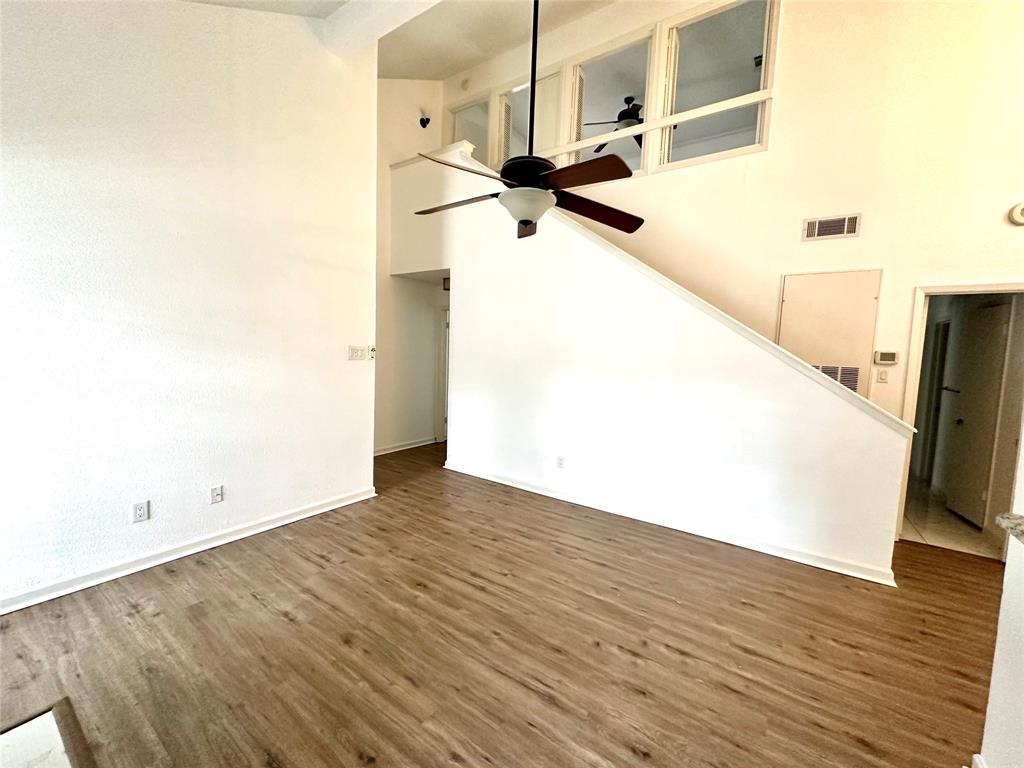 5981 Arapaho Road, Unit 1002 Dallas, TX 75248 - Photo 11 of 16 a view of a room with wooden floor