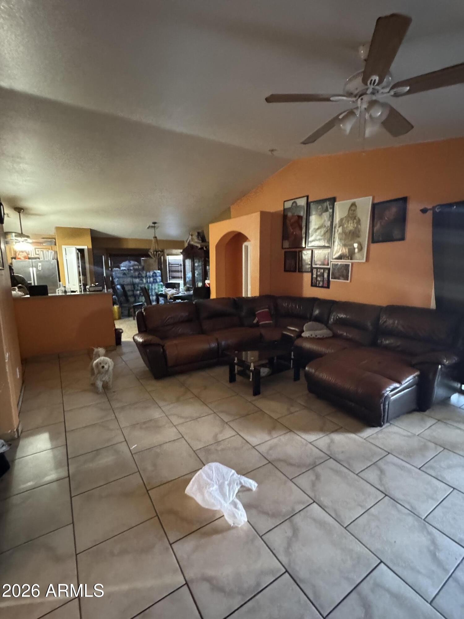 5438 West Sands Road Glendale, AZ 85301 - Photo 3 of 7 a living room with furniture and a chandelier