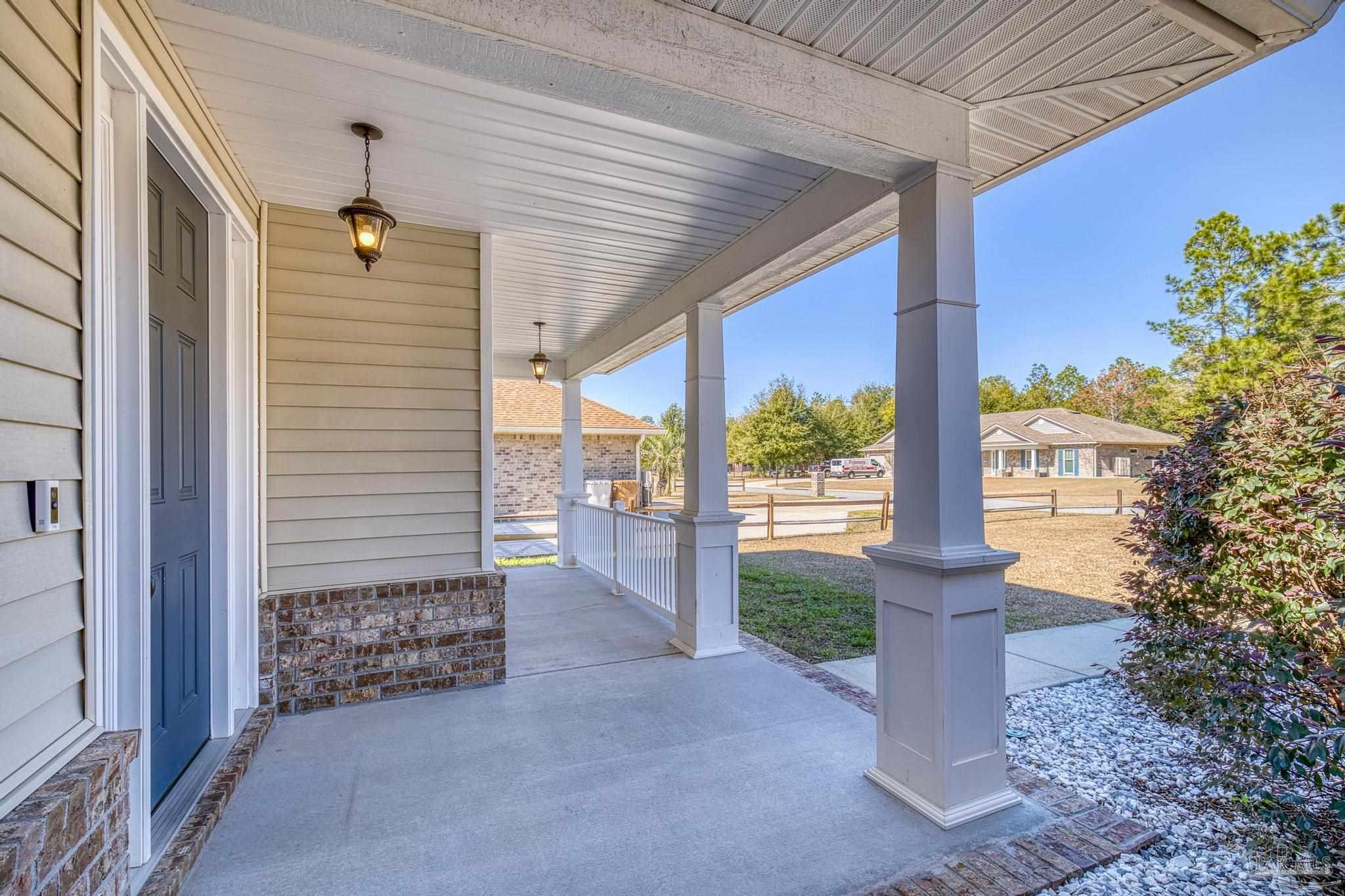 7933 Silver Maple Drive Milton, FL 32583 - Photo 13 of 70 a view of a porch with a tree
