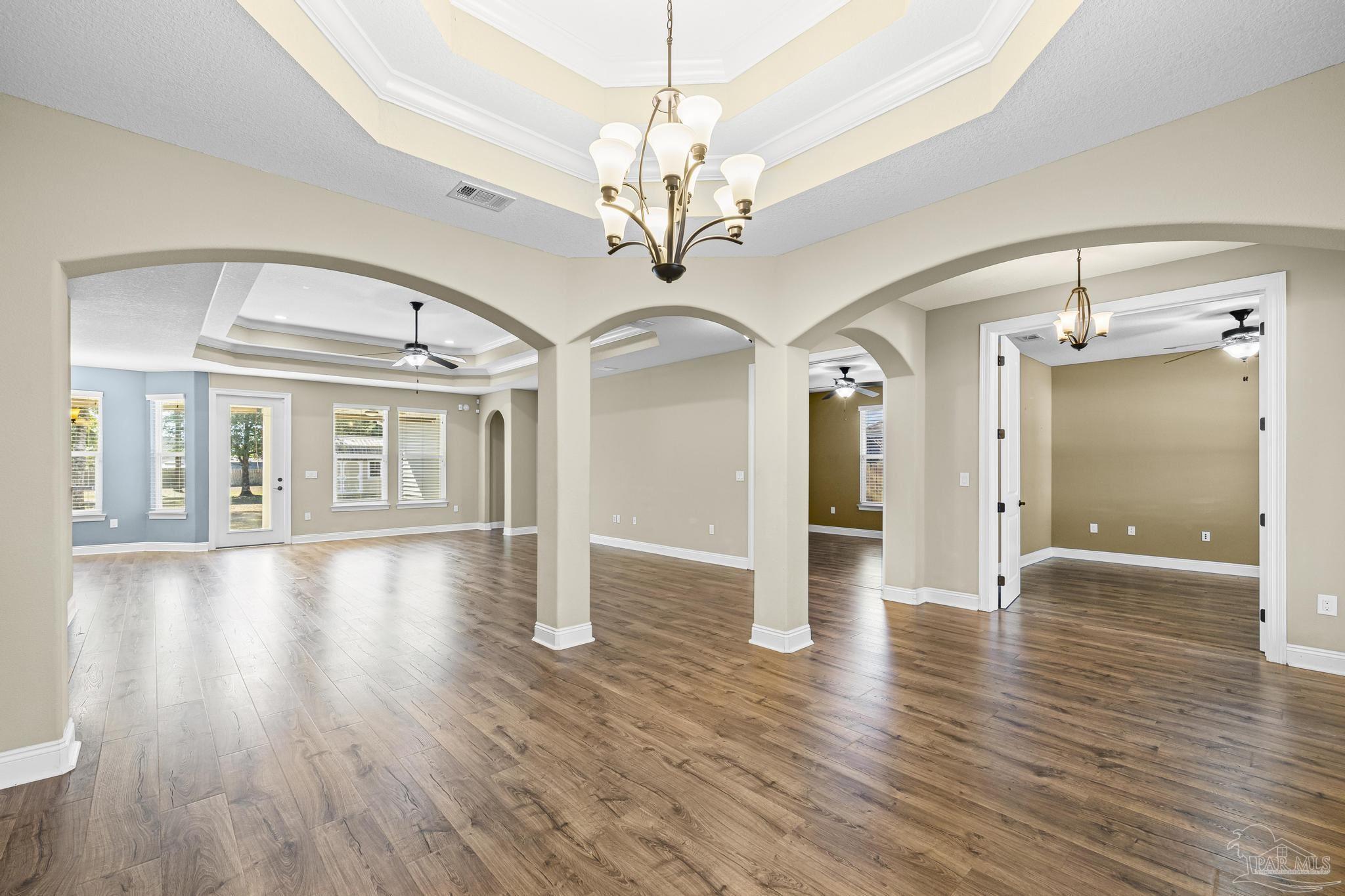 7933 Silver Maple Drive Milton, FL 32583 - Photo 20 of 70 a view of a room with wooden floors closet and windows