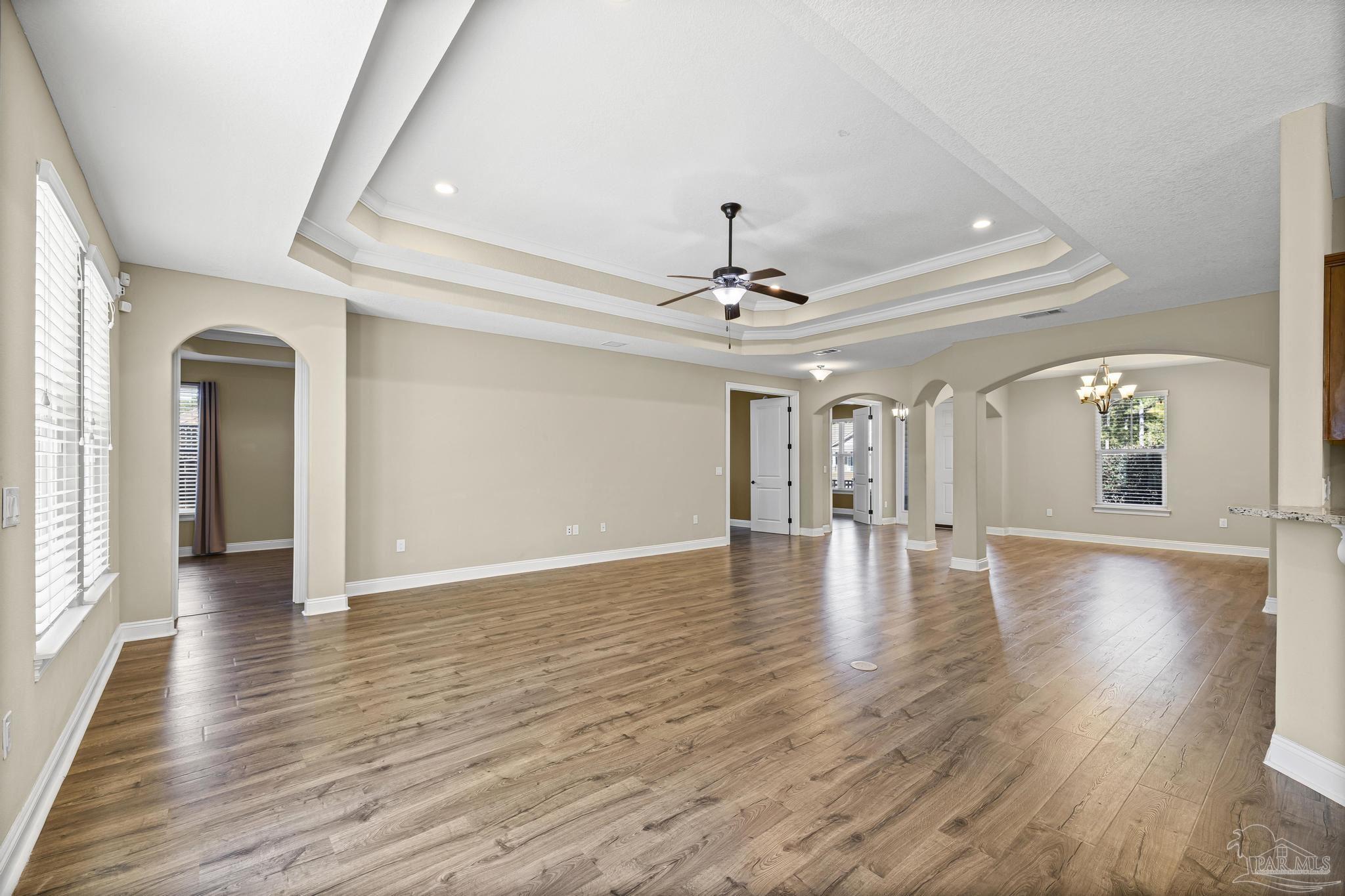 7933 Silver Maple Drive Milton, FL 32583 - Photo 22 of 70 a view of empty room with wooden floor