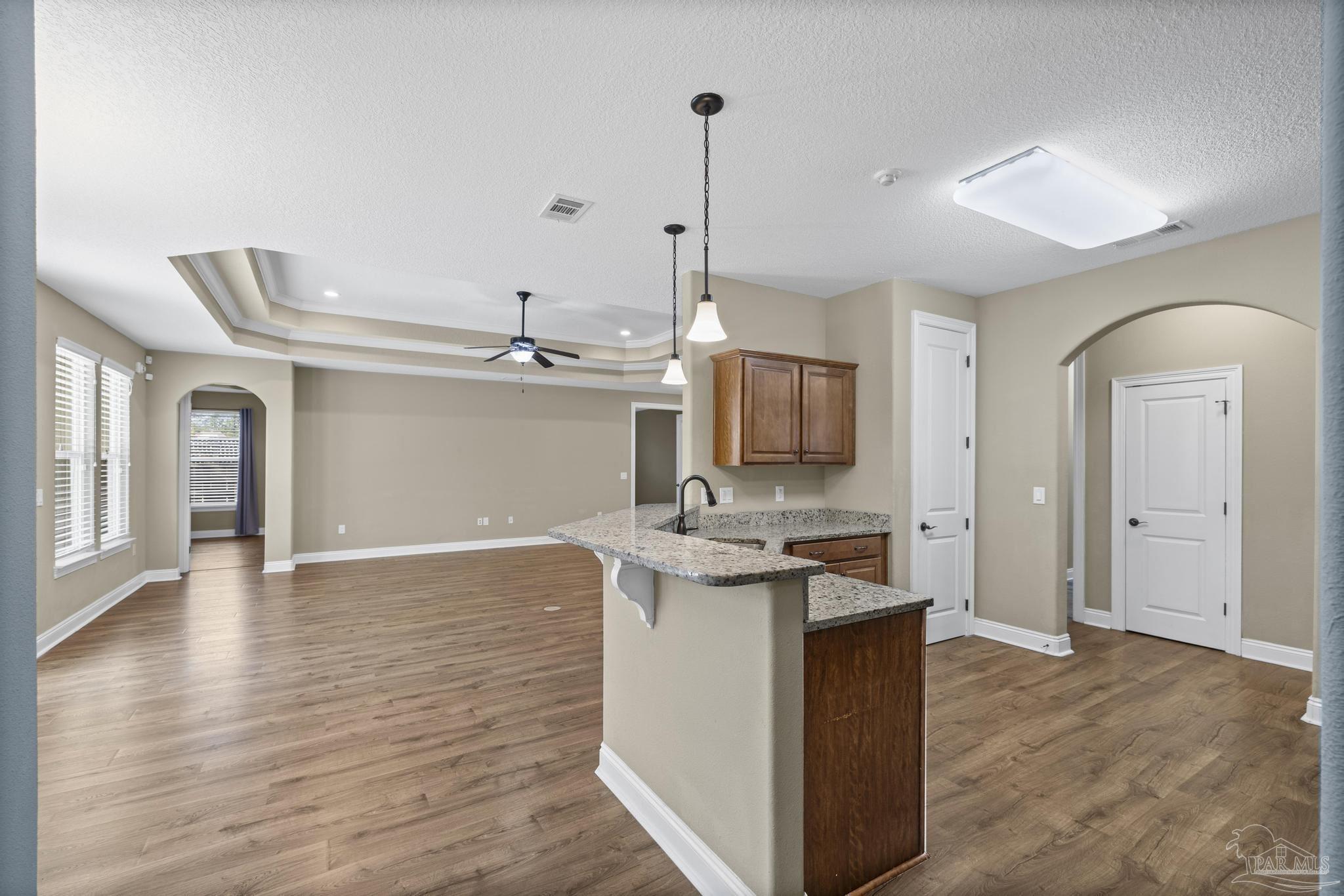 7933 Silver Maple Drive Milton, FL 32583 - Photo 26 of 70 a kitchen with a sink and cabinets