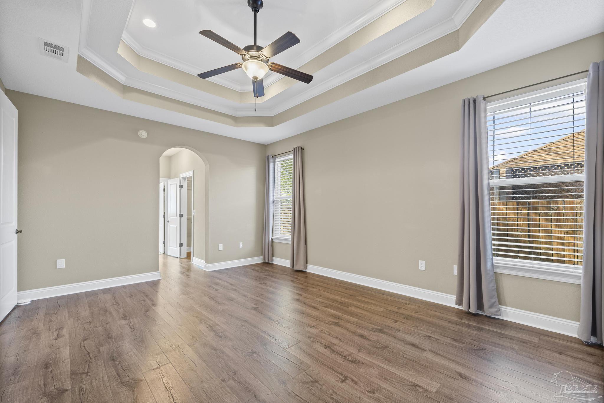 7933 Silver Maple Drive Milton, FL 32583 - Photo 36 of 70 wooden floor in an empty room with a window
