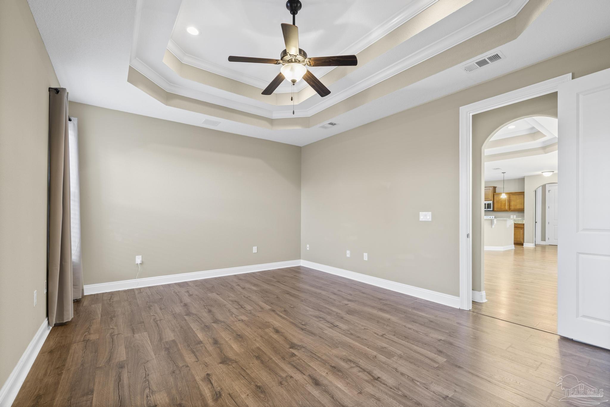 7933 Silver Maple Drive Milton, FL 32583 - Photo 37 of 70 a view of empty room with wooden floor